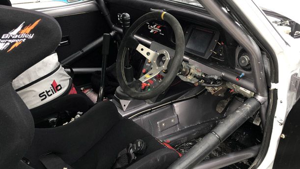 The drivers seat of the rally car.